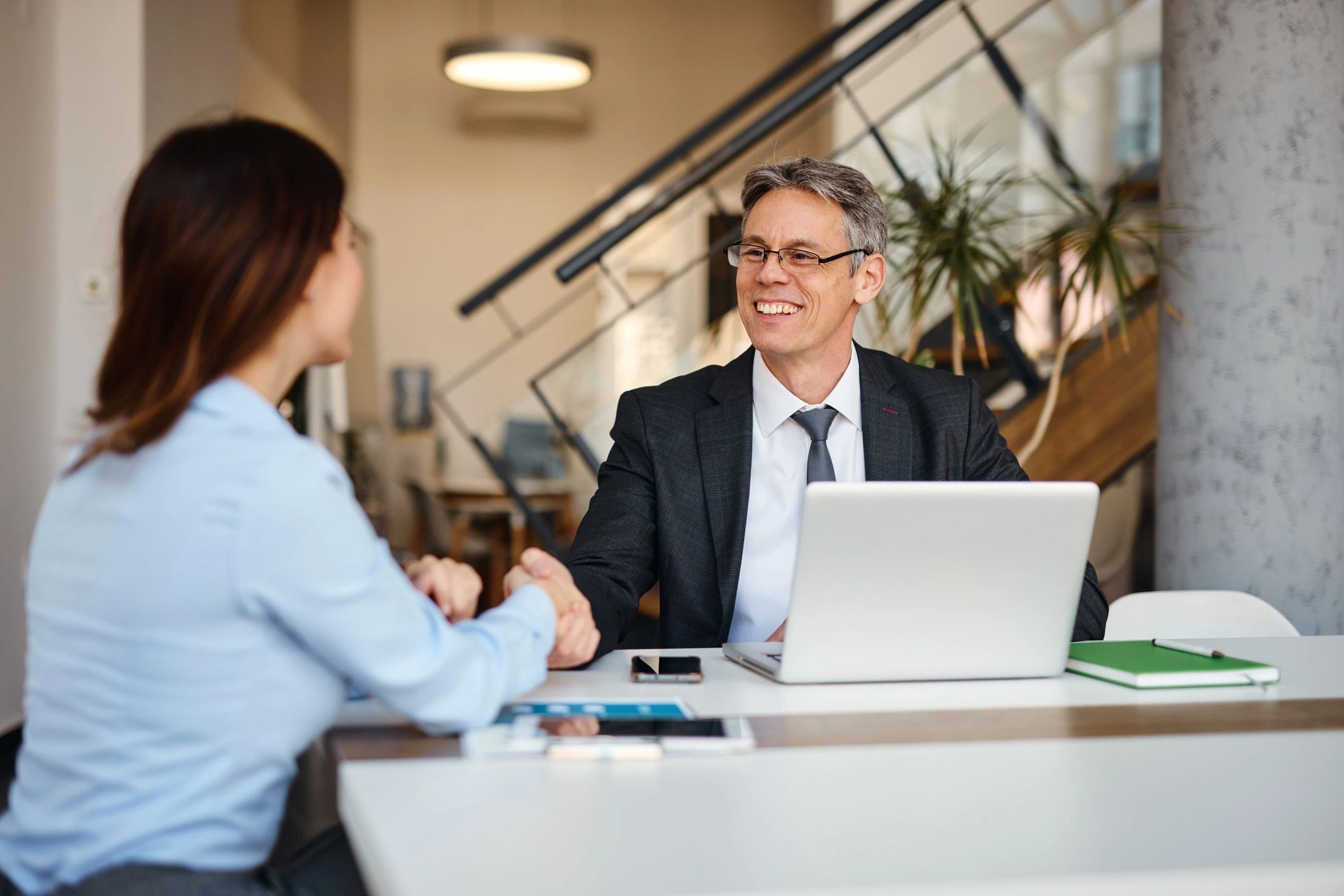 Advisor meeting with client to discuss liability protection