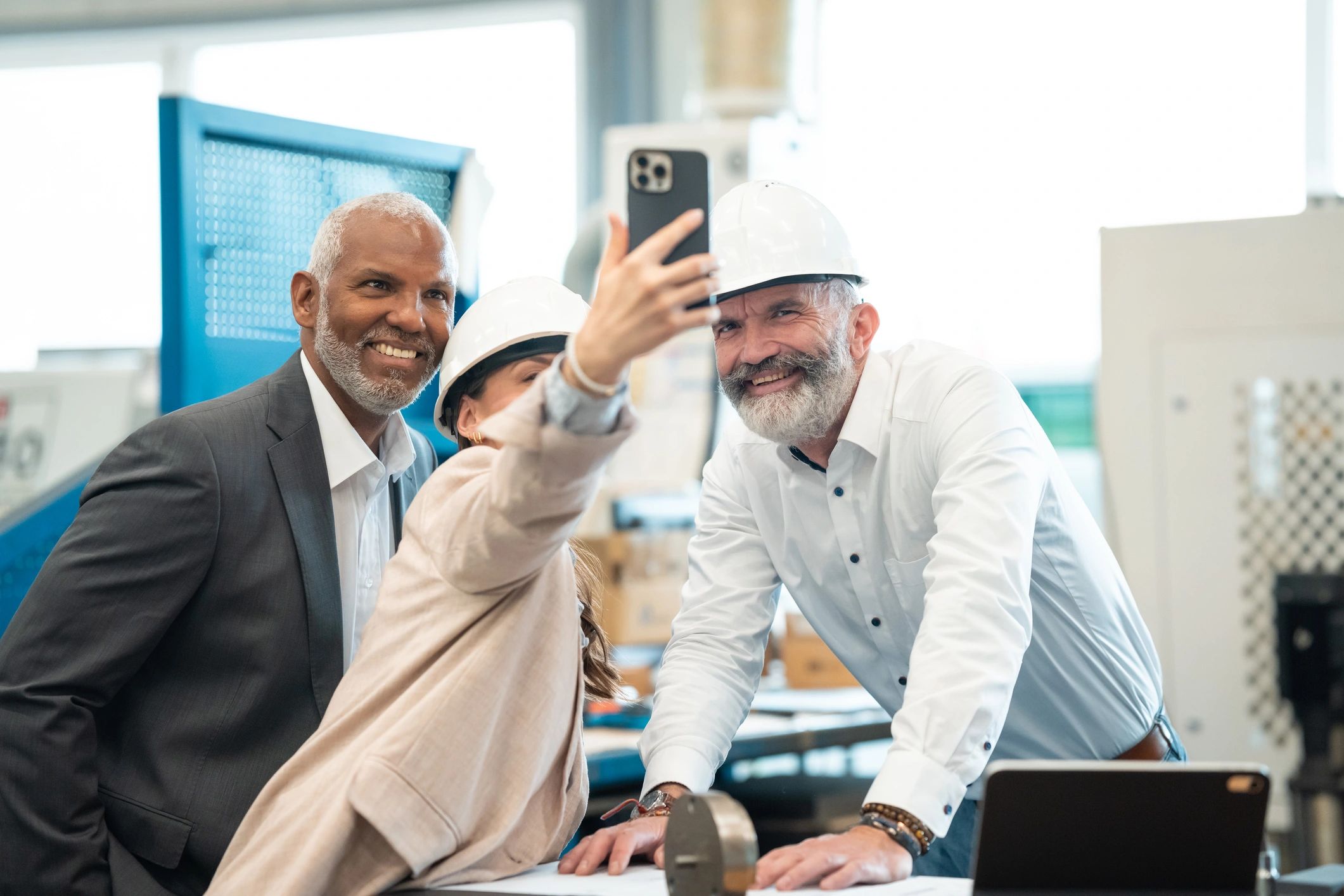 Manufacturing team reviewing production plans on the factory floor
