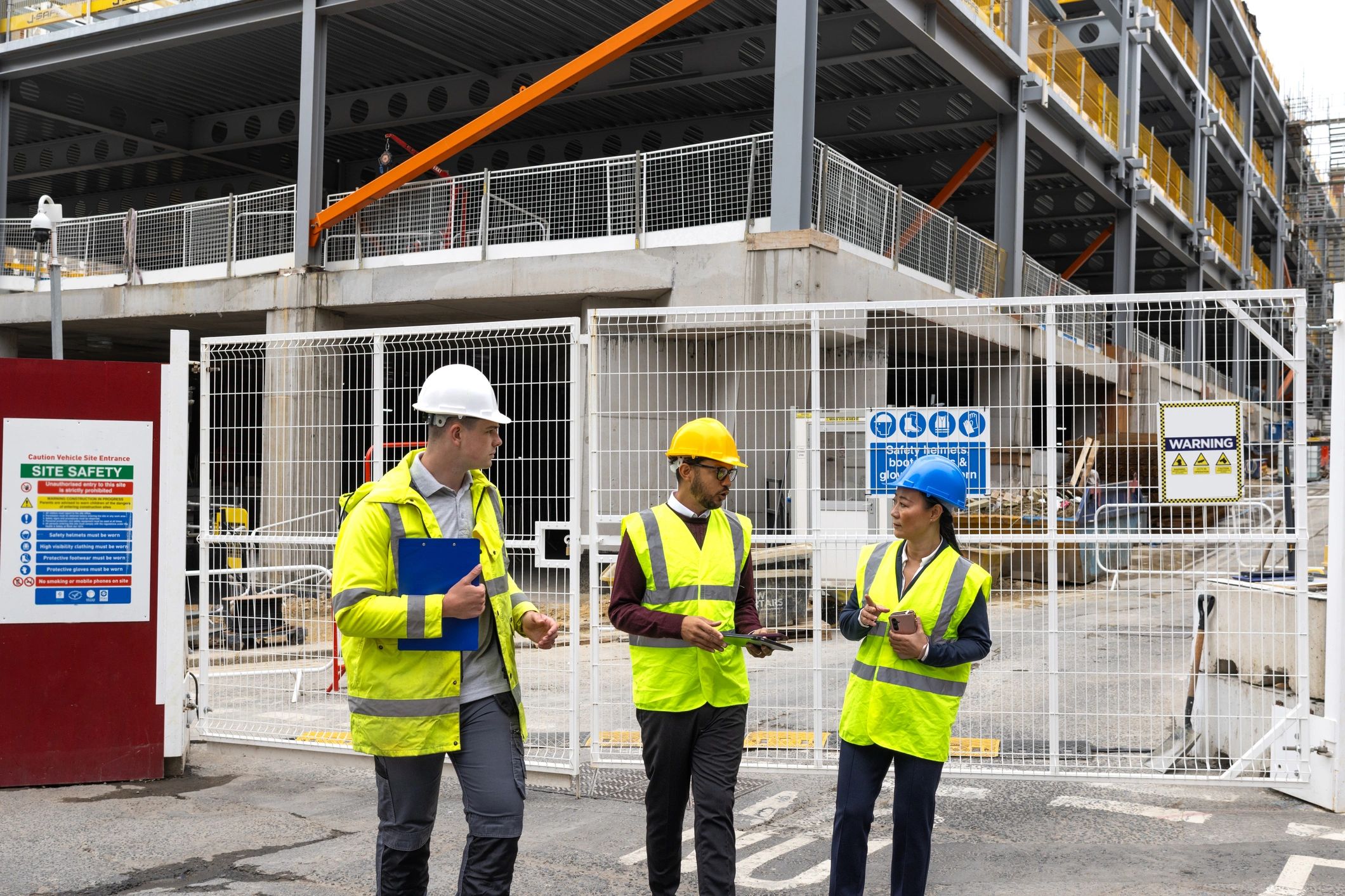 Construction professionals reviewing plans at a job site