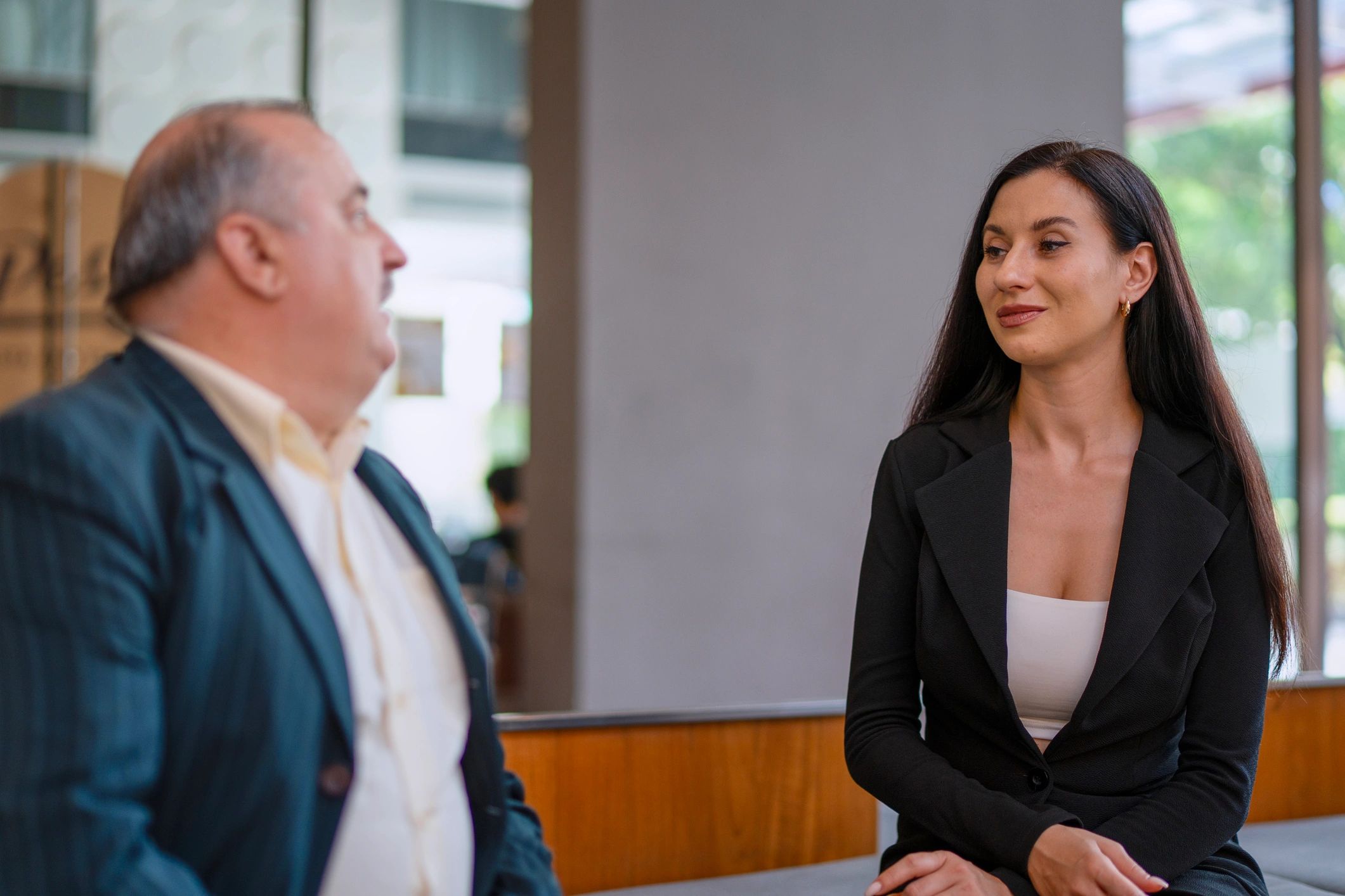 Business professionals meeting in a commercial lobby