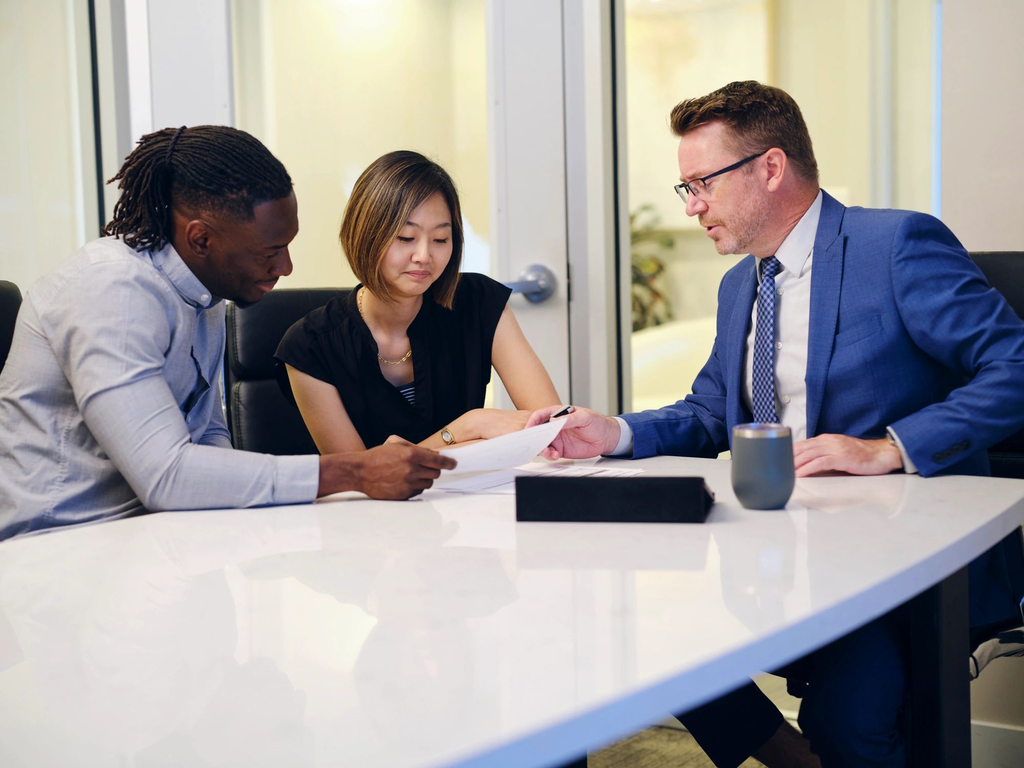 Advisor meeting with clients in an office